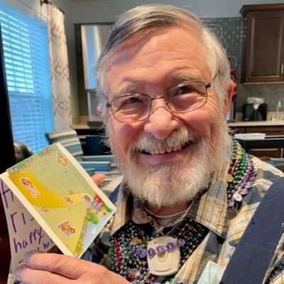 Resident holding a card | National Lutheran Communities & Services