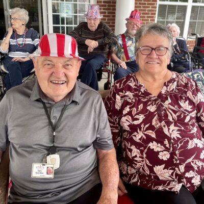 Residents smiling at an event | National Lutheran Communities & Services