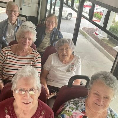 Residents riding in a bus | National Lutheran Communities & Services